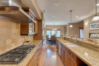 a kitchen with a sink and a stove top oven at Luxe All-Season Retreat by AvantStay Prime Location Near Skiing in Truckee