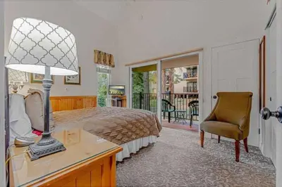 a bedroom with a bed and a desk and a chair at Carnelian Bay 3BR + Loft Near Beach & Trails in Carnelian Bay