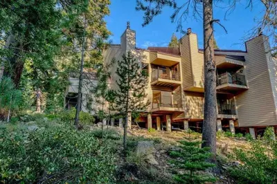 a large house on a hill with trees at Carnelian Bay 3BR + Loft Near Beach & Trails in Carnelian Bay