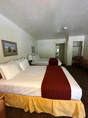 a hotel room with two large beds in it at Mi Wuk Village Inn in Mi-Wuk Village