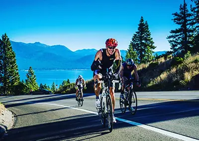 a group of people riding bikes down a road at Lv12 luxury villa with hot tub, close to skiing in Glenbrook