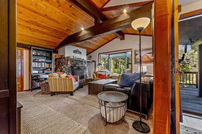 a living room filled with furniture and a wooden ceiling at Secluded Tahoe Retreat Near Trails and Beach in Carnelian Bay