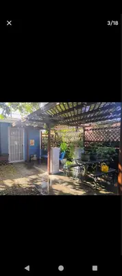 a view of a patio with a table and a pergola at Ping's Tiny Home self-check in & out private in Merced