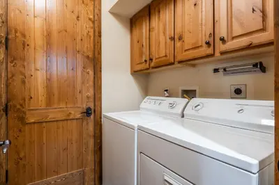 a laundry room with a washer and dryer at Lodges 1156 in Mammoth Lakes