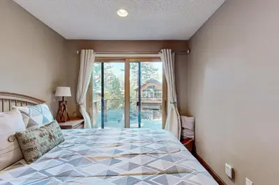 a bedroom with a bed and a large window at Incline Haven in Incline Village