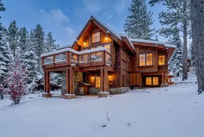 a log home in the snow in the woods at Northstar Hideaway-Private Hot Tub, Shuttle Access in Truckee