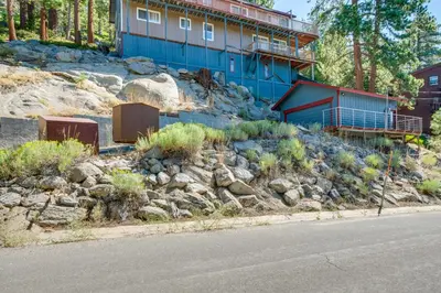 a house on top of a hill with rocks at Scenic Home with Sauna - 7 Mi to Heavenly Mountain! in Kingsbury