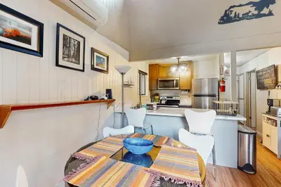 a kitchen and dining room with a table and chairs at Snowy Pines in Fish Camp