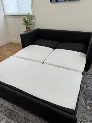a black and white couch in a living room at Studio on Main Street in Roseville