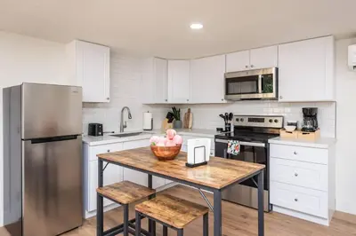 a kitchen with a table with a bowl of fruit on it at Studio on Main Street in Roseville