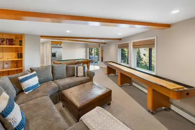 a living room with a couch and a pool table at Luxury Tahoe Vacation Rental with HotTub & Lake Views in Tahoe Vista