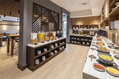 a buffet line with plates of food on display at Hyatt Place Reno in Reno