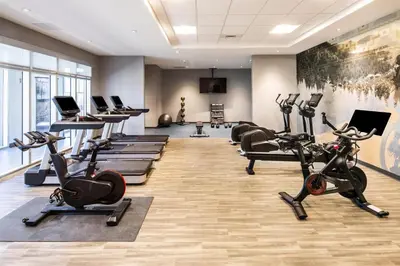 a gym with several treadmills and cardio machines at Hyatt Place Reno in Reno