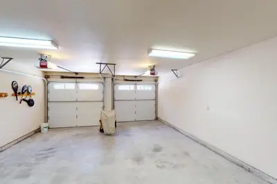 an empty garage with two garage doors at Windwood Inn in Shaver Lake