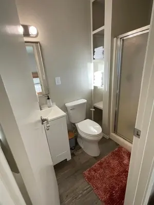 a bathroom with a toilet and a sink and a shower at Spacious sequoia Park retreat, best panoramic views in Three Rivers