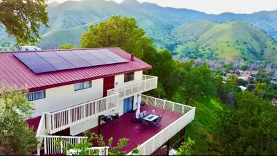 a house with a roof with a solar array on it at Spacious sequoia Park retreat, best panoramic views in Three Rivers