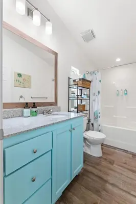 a bathroom with a blue sink and a toilet at Minutes from Sequoia Entrance in Three Rivers