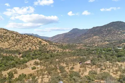 a view of a valley in the mountains at Minutes from Sequoia Entrance in Three Rivers