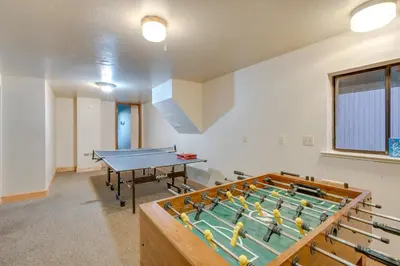 a room with a pool table and a ping pongetitive at Game Rooms, Sauna and Decks South Lake Tahoe Home in South Lake Tahoe