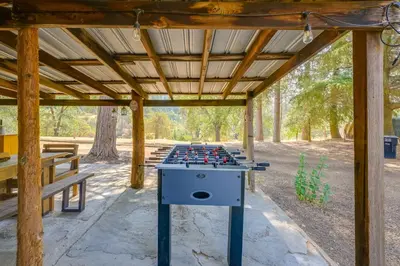 a ping pong table in the middle of a pavilion at Rustic Cabin with Patio 8 Mi to Kings Canyon Park in Miramonte