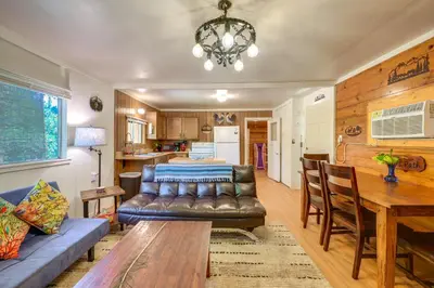 a living room with a couch and a table at Rustic Cabin with Patio 8 Mi to Kings Canyon Park in Miramonte