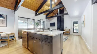 a kitchen with a sink and a dining room at Bigwood #96 condo in Mammoth Lakes