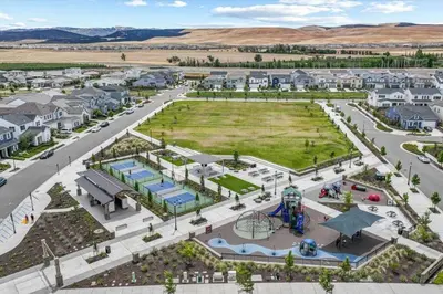 an aerial view of a park with a playground at Cozy Retreat facing Western Park in Tracy