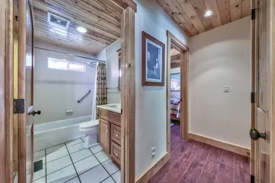 a bathroom with a toilet and a shower and a sink at Tahoe Townie - Cozy Cabin in South Lake Tahoe! in South Lake Tahoe