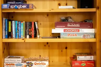 a book shelf filled with books and other books at Elegant 6 Bed Sleeps 14 - Best for families w kids in South Lake Tahoe