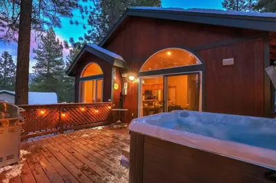 a large bath tub in front of a house at Tahoe Tranquility - Dogs - Hot tub - Ping Pong in South Lake Tahoe