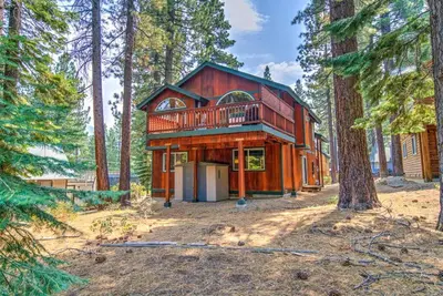 a house in the middle of a forest at Tahoe Tranquility - Dogs - Hot tub - Ping Pong in South Lake Tahoe