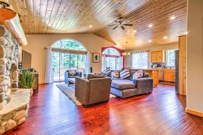 a living room with a couch and a table at Tahoe Tranquility - Dogs - Hot tub - Ping Pong in South Lake Tahoe