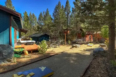 a yard with a house and a playground at Guadalupe Getaway - Pets - Hot Tub - AC in South Lake Tahoe