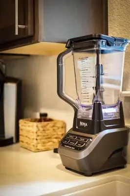 a blender sitting on top of a counter at Bear Cub Cabin - Pets - Hot tub - Arcade Game in Mevers