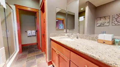 a bathroom with a sink and a mirror at Timbers #27 townhouse in Mammoth Lakes