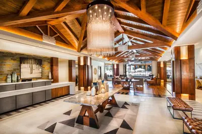 a lobby of a hotel with a table and chairs at Luxury 4BDR Residence steps from Heavenly Village condo in South Lake Tahoe