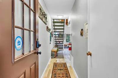 a hallway with a door and a rug at Carnelian Bay 2BR + Loft Near Beach & Trails in Carnelian Bay