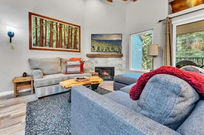 a living room with two couches and a fireplace at Carnelian Bay 2BR + Loft Near Beach & Trails in Carnelian Bay