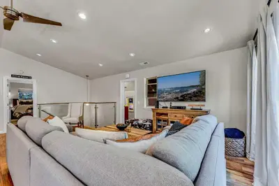 a living room with two couches and a tv at Charming Tahoe Cabin with Private Beach Access in Tahoe City
