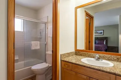 a bathroom with a toilet and a sink and a shower at Snowcreek #793 Phase V - 3 Bedroom 3 Bath Sleeps 8 with Private 1 Car Garage in Mammoth Lakes