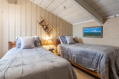a bedroom with two beds in a room at Sierra Park Villas #76, Updated 1 Bedroom + 2 Lofts, 2 Bath, Sleeps 6! in Mammoth Lakes