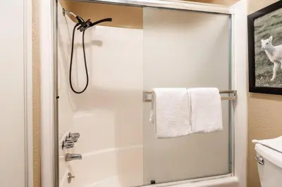a shower with a glass door in a bathroom at Sierra Park Villas #76, Updated 1 Bedroom + 2 Lofts, 2 Bath, Sleeps 6! in Mammoth Lakes