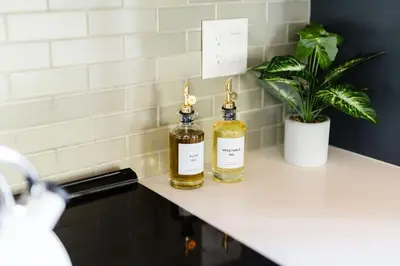 two bottles of essential oils sitting on a counter at Alpenglow Aerie - StayLuxe Rubicon in Meeks Bay