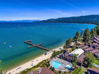 an aerial view of a beach with a pier at The Pad at South Lake Tahoe in Bijou Park