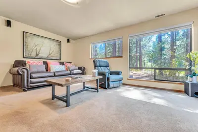 a living room with a couch and a table at Northstar Retreat by Golf Course & Free Shuttle in Truckee