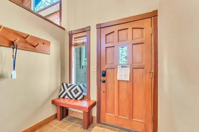 a wooden door with a bench in front of it at Northstar Retreat by Golf Course & Free Shuttle in Truckee