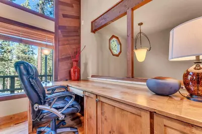 a room with a desk with a chair and a lamp at Northstar Retreat by Golf Course & Free Shuttle in Truckee