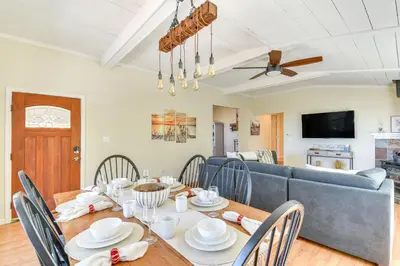 a dining room with a table and a couch at Sonora Hilltop Home Scenic Views, Pet Friendly! in Sonora