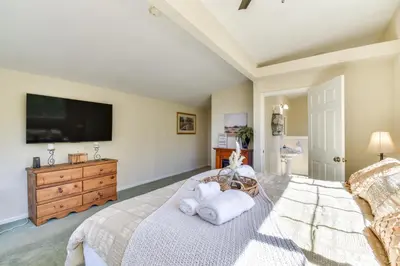 a bedroom with a bed and a flat screen tv at Sonora Hilltop Home Scenic Views, Pet Friendly! in Sonora
