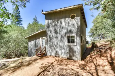 a building with a window on the side of it at Sonora Hilltop Home Scenic Views, Pet Friendly! in Sonora